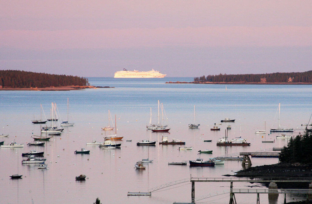 Cruise ship and small boats in the bay at Bar Harbor, Maine, for your Bar Harbor weekend getaway.