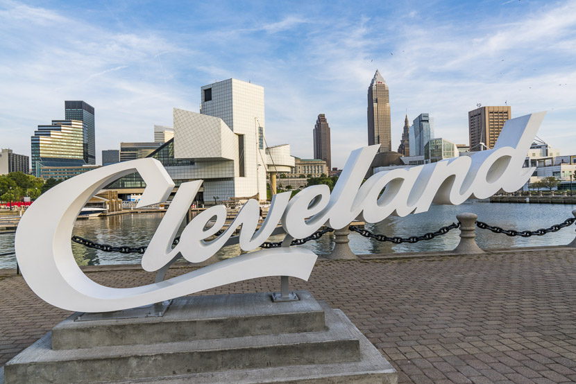 Cleveland sign with the city skyline in the background on a snowy day, to see on your weekend in Cleveland.
